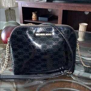 Michael Kors Black Patten Leather Crossbody Bag with Gold Tone Hardware.